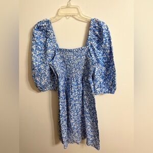 Tuckernuck Blooms on Broad Annie Smocked Dress in a blue and white floral print